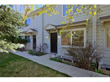 Charming two-story townhouse with manicured lawn, covered entry, and bright, sunlit windows at 3580 Broadway St # 3, Boulder, CO 80304