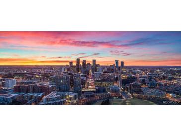 Stunning aerial view of Denver skyline at sunset at 6958 Brentwood Ct, Arvada, CO 80004