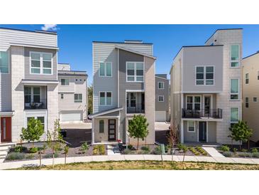 Attractive multi-story home with a modern elevation and front yard landscaping at 12374 Farmview St, Thornton, CO 80241