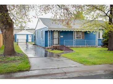 Charming blue bungalow with white trim, tidy landscaping and an inviting front porch at 1235 S Zenobia St, Denver, CO 80219