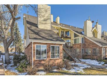 Brick townhouse exterior with stairs and landscaping at 13791 E Lehigh Ave # A, Aurora, CO 80014