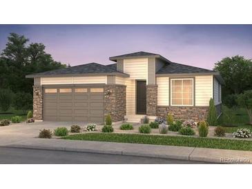 Charming single-story home with stone accents, a two-car garage, and well-manicured landscaping at 2141 S Irvington St, Aurora, CO 80018