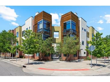 Contemporary condo exterior features mixed materials, balconies and lush, mature landscaping at 2335 Walnut St # 10, Denver, CO 80205