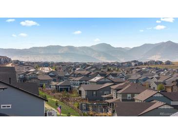Picturesque neighborhood view with rolling hills and mountain backdrop at 17213 W 93Rd Pl, Arvada, CO 80007