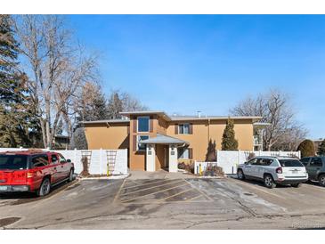 Inviting apartment building with parking in front and a manicured lawn, creating a welcoming curb appeal at 705 S Clinton # 2A, Denver, CO 80247