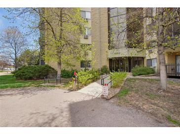 Welcoming entrance with accessible ramp and well-maintained landscaping for easy access to the building at 14300 E Marina Dr # 512, Aurora, CO 80014