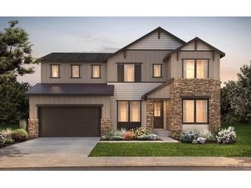 Beautiful two-story home featuring stone accents, a covered entry, and a two-car garage, perfect for a Gathering at 8740 Big Thompson St, Littleton, CO 80125