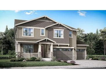 Charming two-story home features a two-car garage and well-manicured lawn at 4003 Descent St, Castle Rock, CO 80108