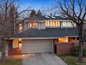 Inviting two-story home with a two-car garage, brick accents and a new roof at 2552 E Alameda Ave # 32, Denver, CO 80209