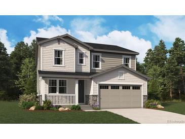 Charming two-story home featuring a covered porch and attached two-car garage at 449 S Salida St, Aurora, CO 80017