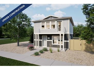 Two-story home with gray siding, white trim, small balcony, and minimal landscaping at 46565 Avery Ln, Bennett, CO 80022