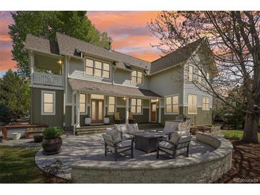 Inviting backyard patio with stone fire pit and outdoor seating, perfect for entertaining and relaxing at 474 W Spruce St, Louisville, CO 80027