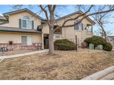 Inviting exterior with manicured landscaping and classic architectural details at 8621 E Dry Creek Rd # 325, Englewood, CO 80112