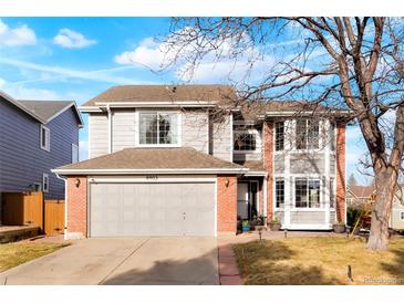 Charming two-story home with a two car garage and a well maintained lawn at 8903 Edgewood St, Highlands Ranch, CO 80130