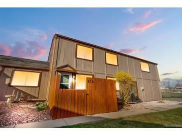 Charming two-story home with a well-maintained lawn, fenced front yard and a lovely garden at 7700 W Glasgow Pl # 10A, Littleton, CO 80128