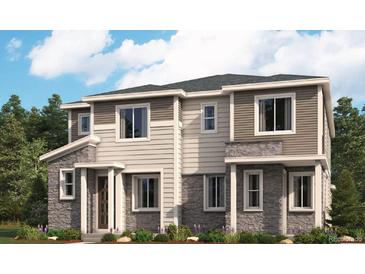 Beautiful two-story home featuring stone accents, neutral siding and well manicured landscaping at 24098 E Warm Springs Ave, Aurora, CO 80019