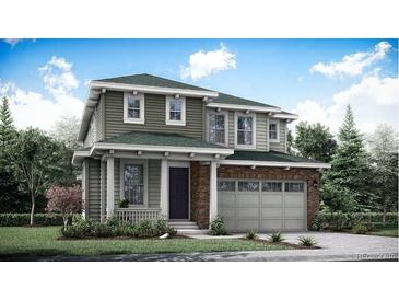 Charming two-story home featuring a brick-accented garage and a covered porch at 12686 W Frost Ave, Littleton, CO 80127