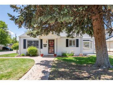 Charming single-story home with a brick walkway, green lawn, and mature landscaping at 4197 S Grant St, Englewood, CO 80113