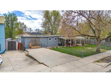 Inviting backyard with a covered patio, perfect for outdoor dining and relaxation, plus a shed for extra storage at 675 Pierce St, Erie, CO 80516