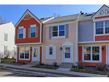 Charming multi-colored townhomes with individual entryways and manicured landscaping at 6776 S Holland Way, Littleton, CO 80128