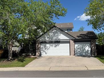 Charming home featuring an attached two-car garage, mature trees, and inviting curb appeal at 9638 Marion Way, Thornton, CO 80229