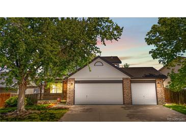 Charming two-car garage with stone accents and lovely curb appeal at 9638 Marion Way, Thornton, CO 80229