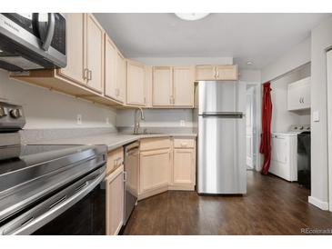 Well-lit kitchen with stainless steel appliances, ample cabinetry, and modern countertops at 185 S Sable Blvd # T18, Aurora, CO 80012