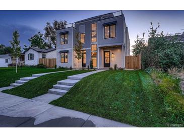 Modern home showcasing a well-manicured lawn and contemporary architectural design at 2349 S Bannock St, Denver, CO 80223