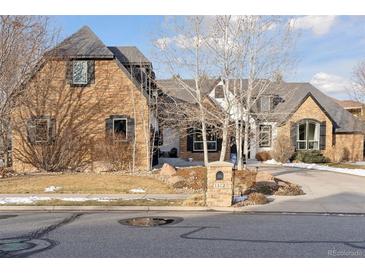 Stunning two-story home with stone accents and a landscaped yard at 1312 Jade Ln, Longmont, CO 80504