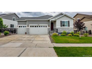 Charming two-story home with landscaped yard and attached two car garage at 22662 E Narrowleaf Cir, Aurora, CO 80016