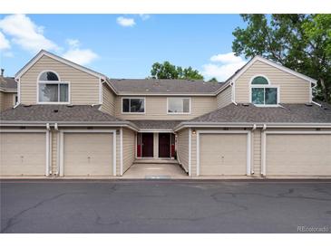 Charming townhome featuring individual garages and inviting entryway at 7476 E Arkansas Ave # 1-03, Denver, CO 80231