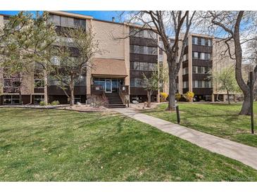 Attractive condominium exterior with well-maintained landscaping and inviting entrance at 3460 S Poplar St # 404, Denver, CO 80224