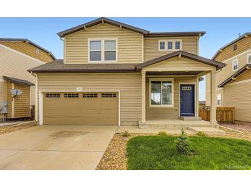 Charming two-story home featuring a two-car garage, blue door, and well-maintained front yard at 1998 Coach House Loop, Castle Rock, CO 80109