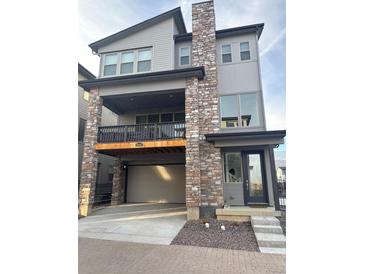Two-story home with stone accents and a modern design at 15682 W Girard Ave, Morrison, CO 80465