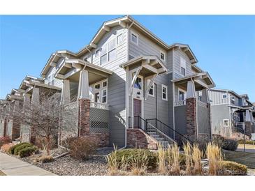 Three-story condo featuring attractive architecture and landscaping at 1601 Venice Ln, Longmont, CO 80503