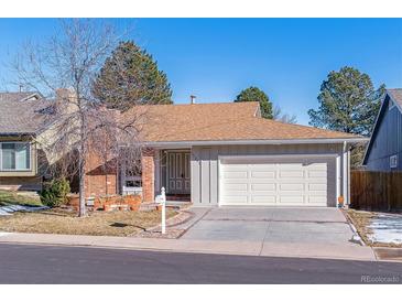 Ranch style home with attached garage and landscaping at 12224 E Amherst Cir, Aurora, CO 80014