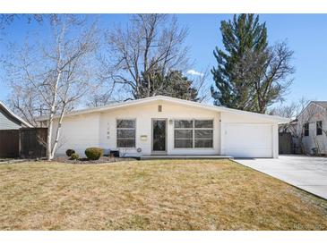 Inviting single-story home featuring manicured lawn, attached garage, and a bright, modern façade at 1360 S Hudson St, Denver, CO 80222