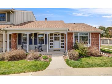 Charming single Gathering home with inviting front porch and well-manicured lawn at 2757 E Geddes Ave, Centennial, CO 80122