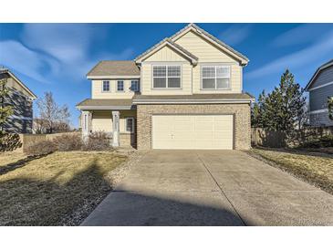 Charming two-story home with a two-car garage and a well-maintained front yard at 254 Ellendale St, Castle Rock, CO 80104