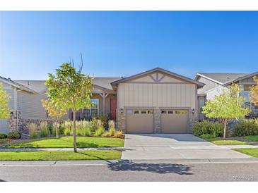 Charming two-story home with a well-manicured lawn and a two car garage, perfect for suburban living at 22646 E Glidden Dr, Aurora, CO 80016