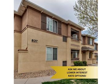 Attractive condo complex featuring earth-tone stucco, dark shutters and cozy second story terraces at 837 E 98Th Ave # 403, Thornton, CO 80229