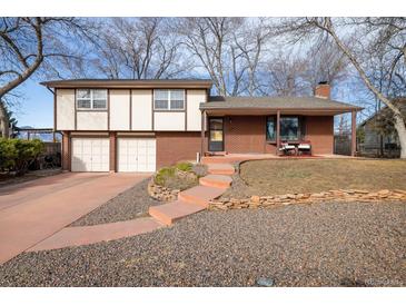 Charming two-story home with brick and siding, attached two-car garage, and welcoming front porch at 4631 Ashfield Dr, Boulder, CO 80301