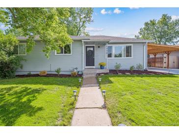 Charming single-story home with manicured lawn and inviting walkway leading to the front door at 1888 S Filbert Ct, Denver, CO 80222