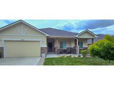 Charming single-story home featuring a well-manicured front yard and a neutral-colored exterior at 9744 W Ontario Pl, Littleton, CO 80128