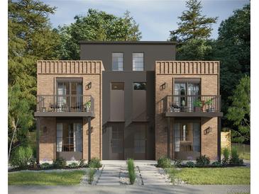 Modern townhome with brick accents, second-story balconies, and professionally landscaped front yard at 4512 Utica St, Denver, CO 80212