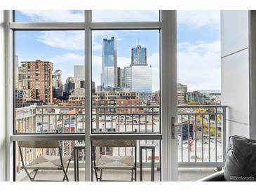 Balcony features a stunning city view, complete with seating and an open, airy ambiance at 1411 Wynkoop St # 806, Denver, CO 80202