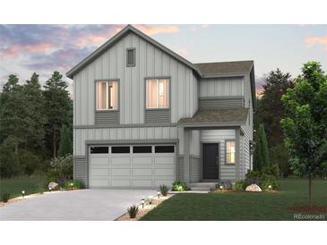 Two-story house with gray siding, two-car garage, and landscaped lawn at 19078 E 94Th Pl, Commerce City, CO 80022