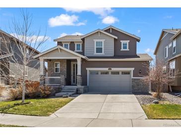 Charming two-story home with a well-manicured lawn and attached two car garage at 24784 E Tennessee Pl, Aurora, CO 80018