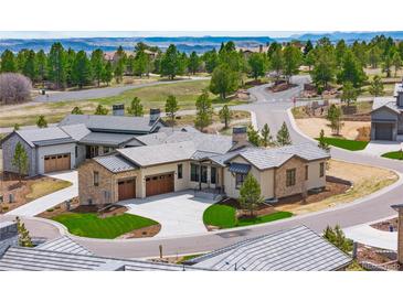 Beautiful exterior elevation showcasing professional landscaping and views of the scenic community at 8015 Parnassus Pl, Castle Rock, CO 80108