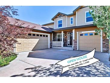 Charming two-story home featuring a three-car garage and well-maintained landscaping at 10646 Amesbury Way, Highlands Ranch, CO 80126